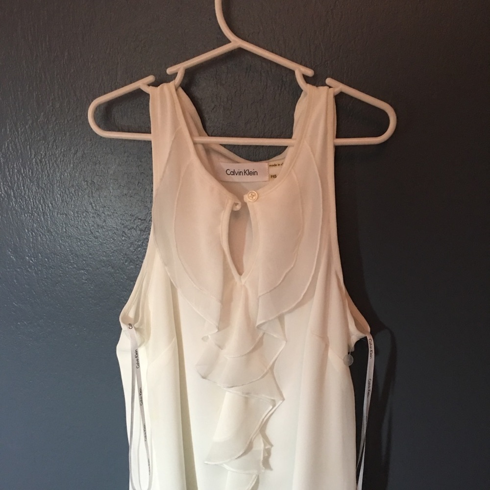 White sleeveless blouse